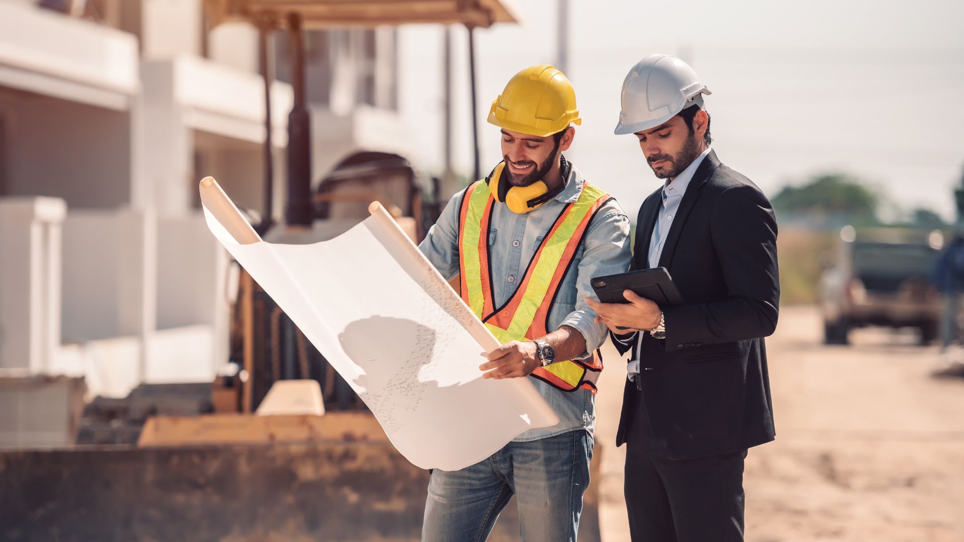 Construction business owner reviewing debt restructuring plan with financial advisor to reduce monthly debt obligations